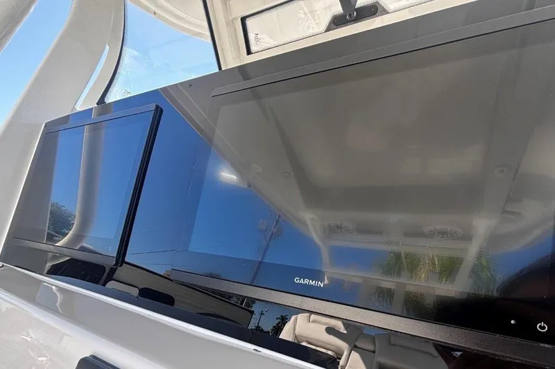 Slide: The Image of Garmin display on 2026 Tidewater 302 CC Adventure boat dashboard. - 45
