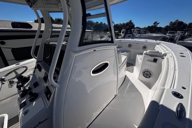 Slide: The Image of 2026 Tidewater 302 CC Adventure boat interior with sleek design and modern controls. - 47