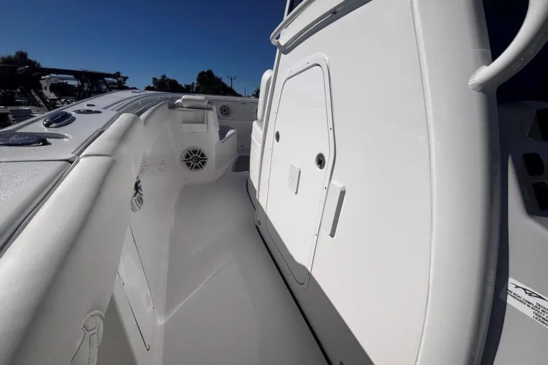 Slide: The Image of 2026 Tidewater 302 CC Adventure boat interior, showcasing sleek white design and modern features. - 49