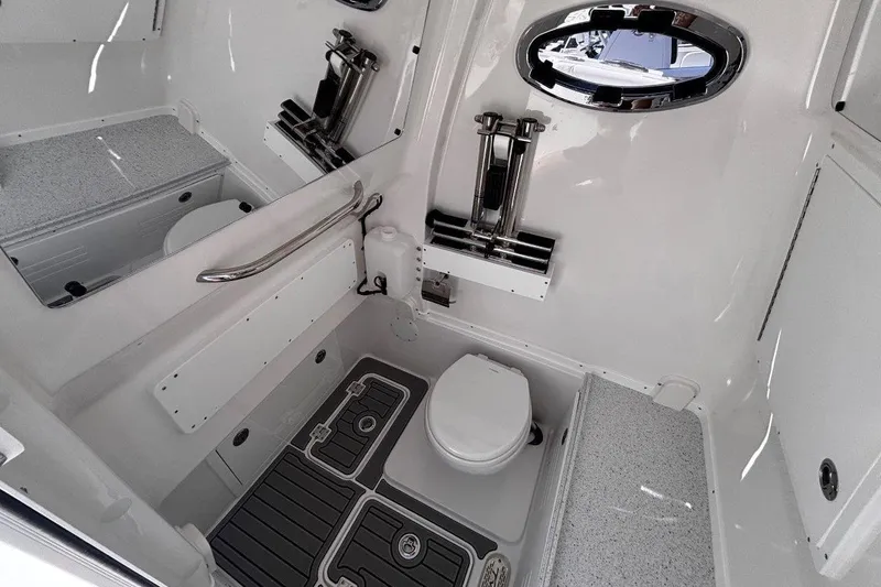Slide: The Image of 2026 Tidewater 302 CC Adventure boat interior with modern bathroom amenities. - 51