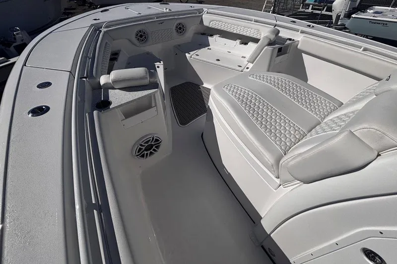 Slide: The Image of 2026 Tidewater 302 CC Adventure boat interior with luxurious seating and modern design. - 54