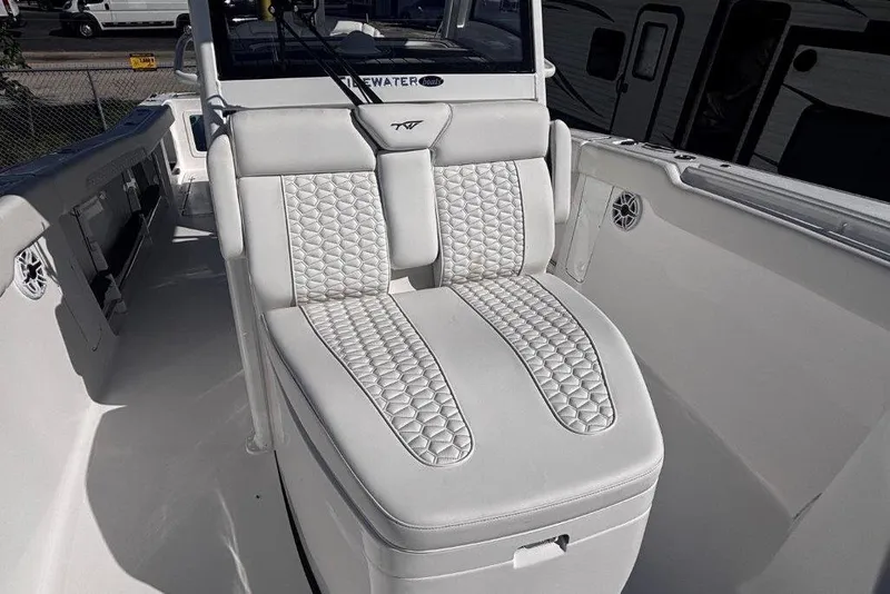 Slide: The Image of 2026 Tidewater 302 CC Adventure boat with luxurious white seating and modern design. - 55