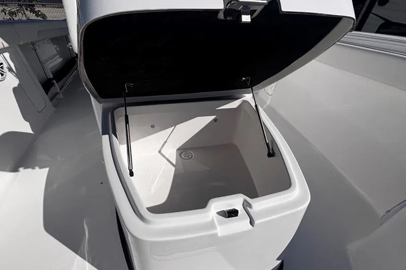 Slide: The Image of Open storage compartment on 2026 Tidewater 302 CC Adventure boat. - 56