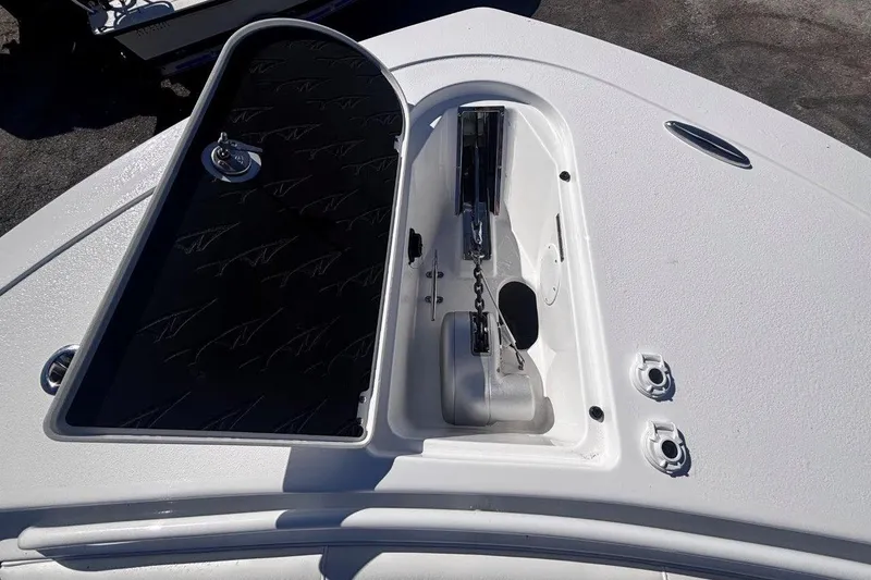 Slide: The Image of Open anchor compartment on 2026 Tidewater 302 CC Adventure boat. - 60