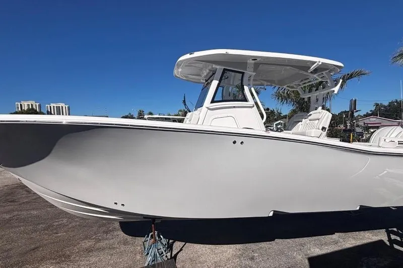 The Image of 2026 Tidewater 302 CC Adventure boat under clear blue sky. - 8