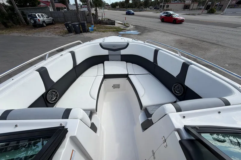 Slide: The Image of 2024 Chaparral 270 OSX boat interior with spacious seating and modern design. - 5