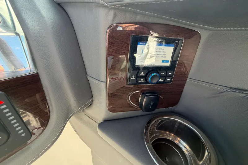 Slide: The Image of 2024 Chaparral 270 OSX dashboard with Bluetooth stereo and USB port. - 9