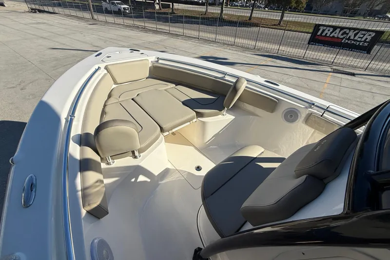 Slide: The Image of 2022 Key West 239 FS boat interior with cushioned seating and sleek design. - 10