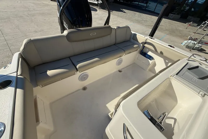 Slide: The Image of 2022 Key West 239 FS boat interior with seating and storage compartments. - 14