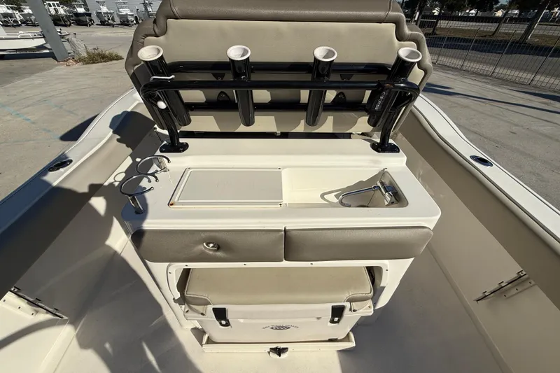 Slide: The Image of 2022 Key West 239 FS boat interior with rod holders and storage compartments. - 15