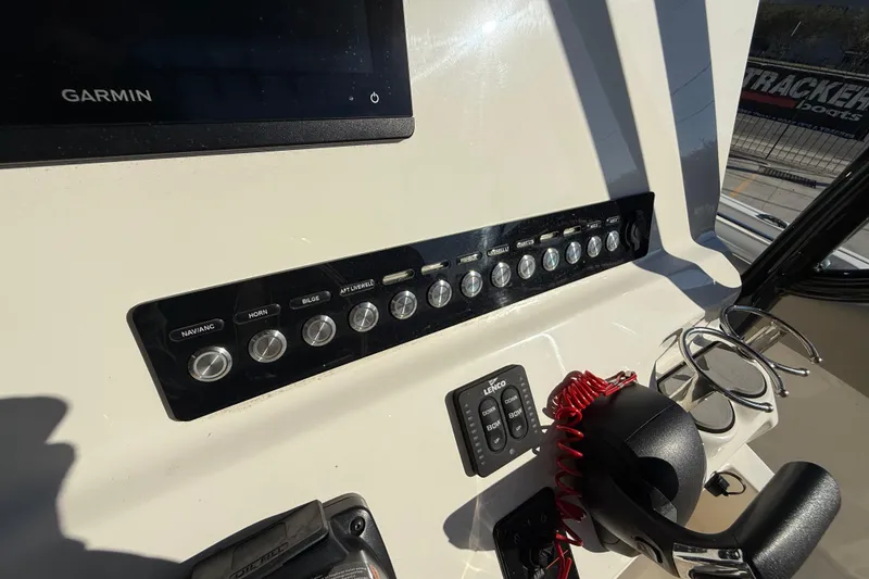 Slide: The Image of 2022 Key West 239 FS boat dashboard with Garmin display and control panel. - 17
