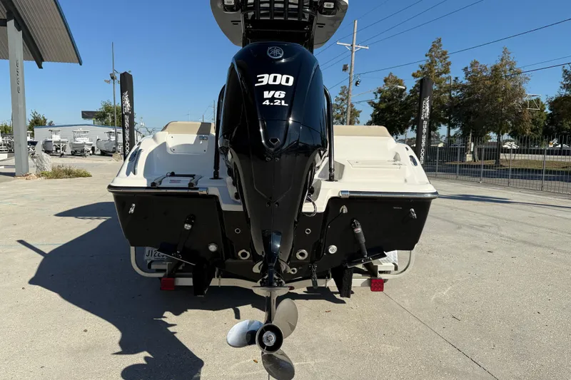 Slide: The Image of 2022 Key West 239 FS boat with Yamaha 300 V6 engine, parked outdoors. - 6