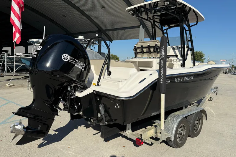Slide: The Image of 2022 Key West 239 FS boat with Yamaha outboard motor on a trailer. - 7