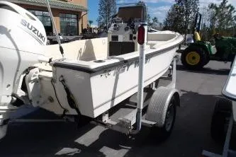 The Image of 1994 Key West 1720 Sportsman boat on trailer with Suzuki outboard motor. - 0