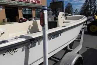 Slide: The Image of 1994 Key West 1720 Sportsman boat on trailer, parked outside a service center. - 7