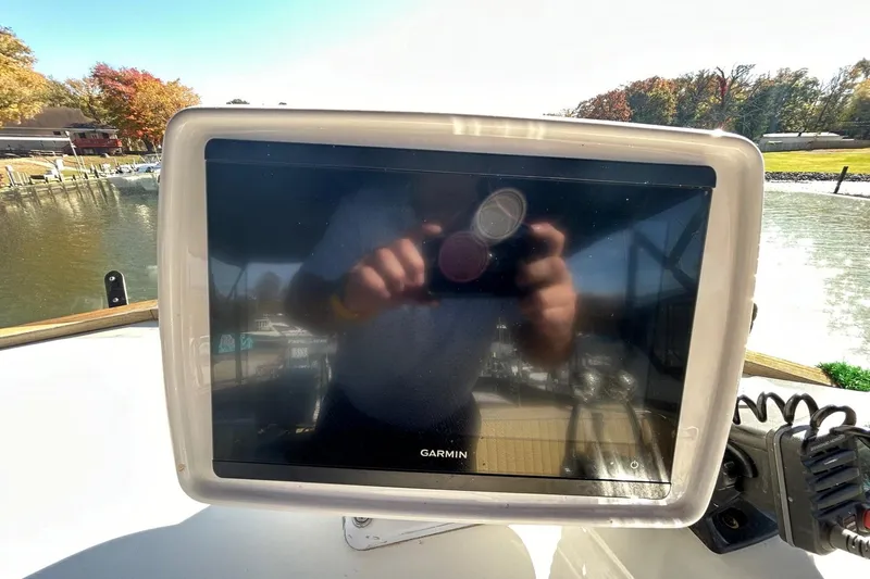 Slide: The Image of Garmin navigation display on 1986 Grand Banks 42 Classic boat, reflecting surroundings. - 15