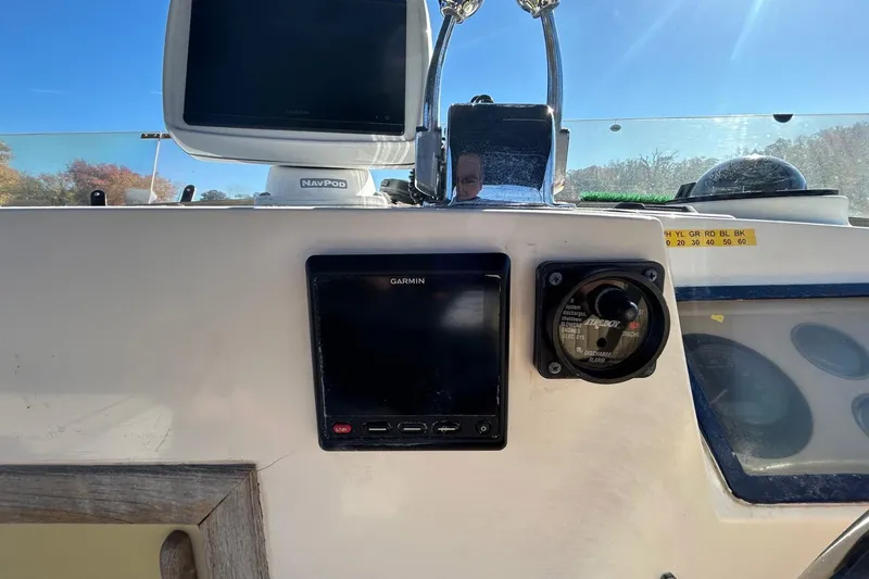 Slide: The Image of Control panel of a 1986 Grand Banks 42 Classic boat with Garmin navigation system. - 16