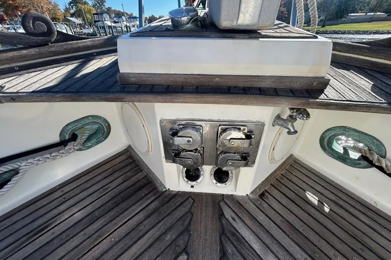 Slide: The Image of 1986 Grand Banks 42 Classic deck with winches and cleats, showcasing nautical equipment. - 22