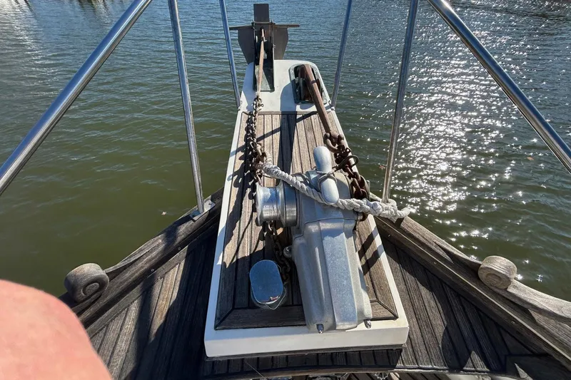 Slide: The Image of Bow of 1986 Grand Banks 42 Classic yacht with anchor and chain. - 23