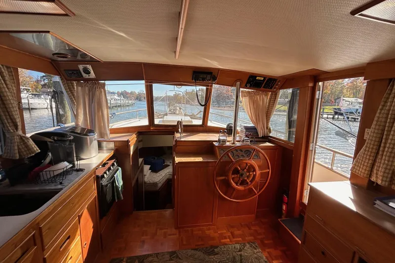 Slide: The Image of Interior of 1986 Grand Banks 42 Classic yacht with wooden helm and cozy cabin. - 30