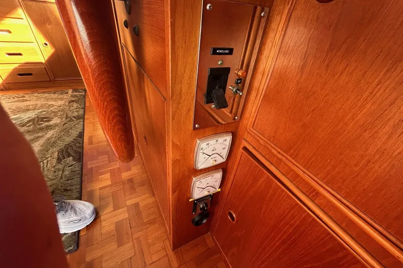 Slide: The Image of Wooden interior of 1986 Grand Banks 42 Classic yacht with control panel and gauges. - 34