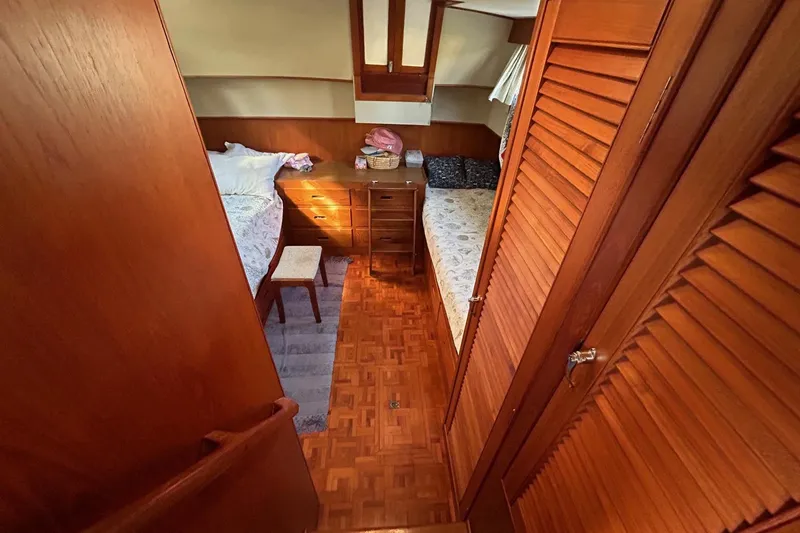 Slide: The Image of Cozy cabin interior of 1986 Grand Banks 42 Classic yacht with twin beds and wooden decor. - 37