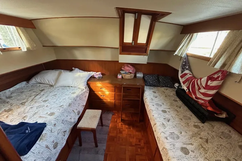 Slide: The Image of Cozy cabin interior of 1986 Grand Banks 42 Classic with twin beds and wooden furnishings. - 38