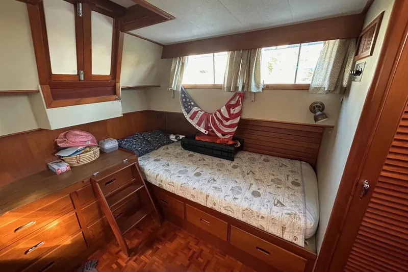 Slide: The Image of Cozy cabin interior of 1986 Grand Banks 42 Classic yacht with wooden furnishings. - 40