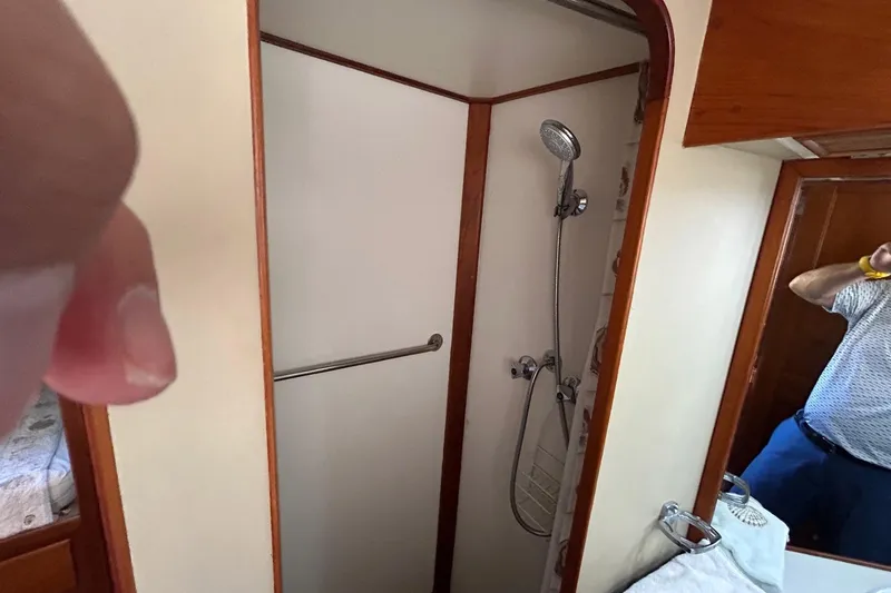 Slide: The Image of Shower area inside 1986 Grand Banks 42 Classic yacht with wooden trim. - 43