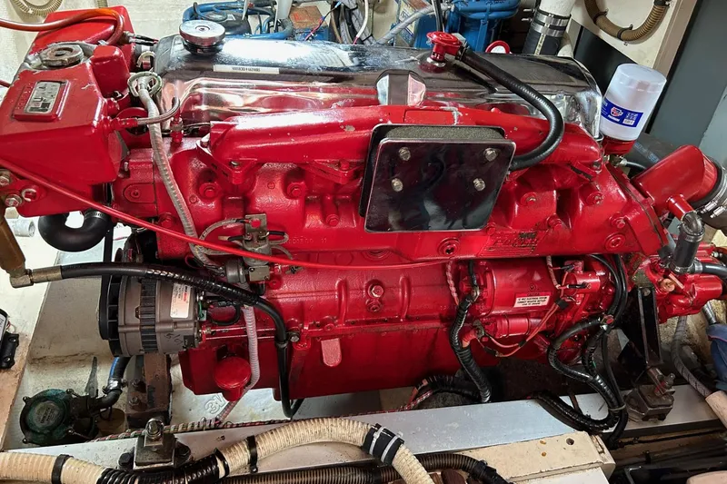 Slide: The Image of Red engine of a 1986 Grand Banks 42 Classic boat, detailed view. - 51