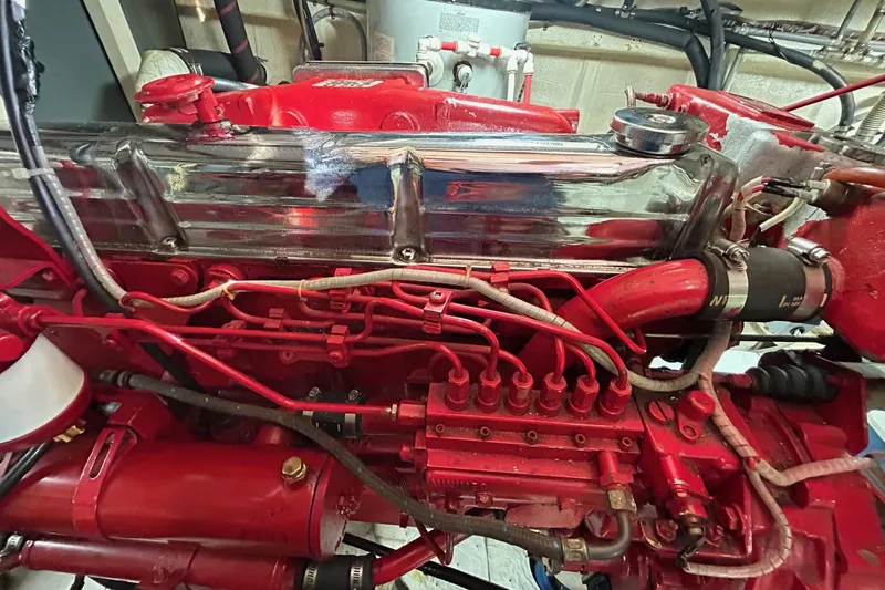 Slide: The Image of Engine of a 1986 Grand Banks 42 Classic, showcasing detailed mechanical components. - 60