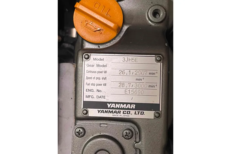 Slide: The Image of Yanmar engine label on a 2003 Lagoon 410-S2, model 3JH5E, with orange oil cap. - 13