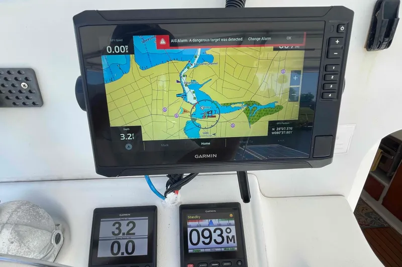 Slide: The Image of Garmin navigation system on Lagoon 410-S2, 2003 model, displaying nautical map and AIS alarm. - 17