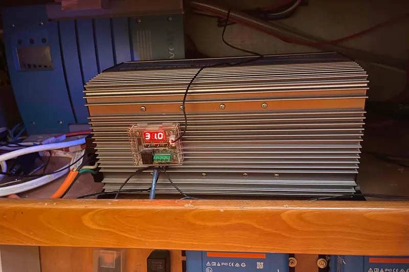 Slide: The Image of Three Victron Energy SmartSolar charge controllers installed on a Lagoon 410-S2, 2003 model. - 29