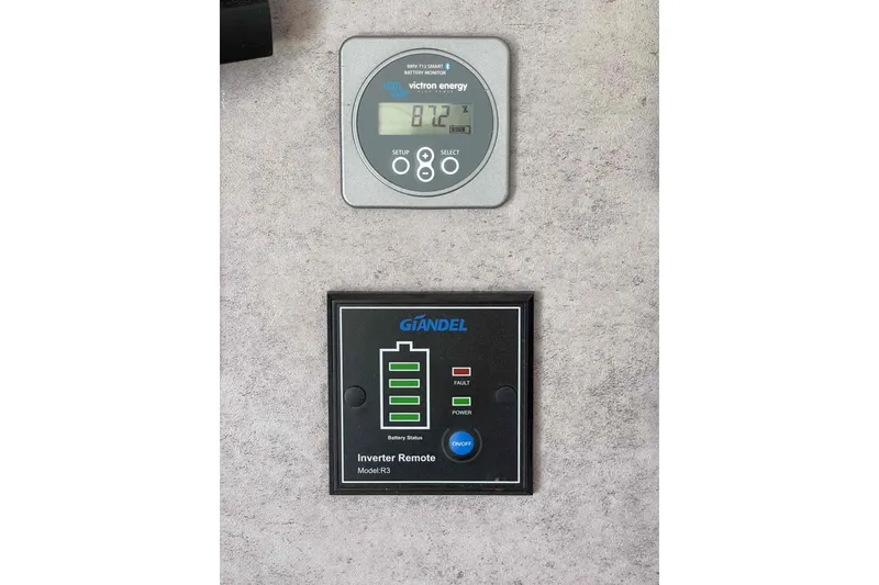 Slide: The Image of Garmin GPSMAP 7610 on 2003 Lagoon 410-S2 yacht dashboard with voltage and USB ports. - 34