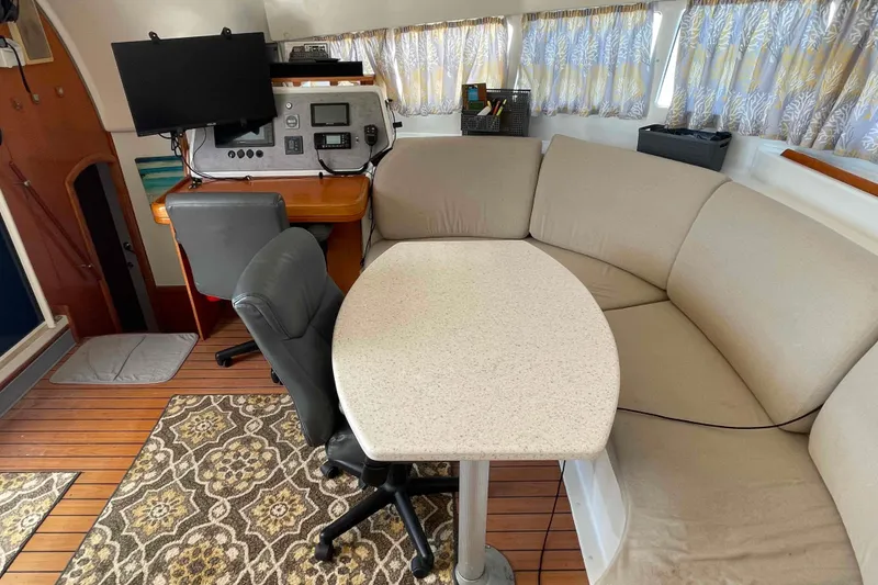 Slide: The Image of Interior of 2003 Lagoon 410-S2 catamaran with storage shelves and wooden flooring. - 53