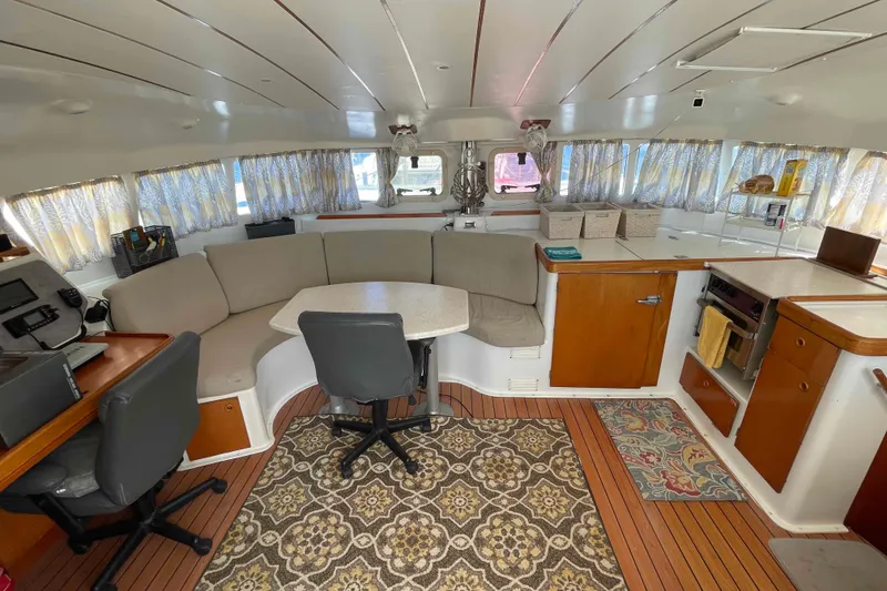 Slide: The Image of Storage area in a 2003 Lagoon 410-S2 yacht filled with bags and containers. - 57