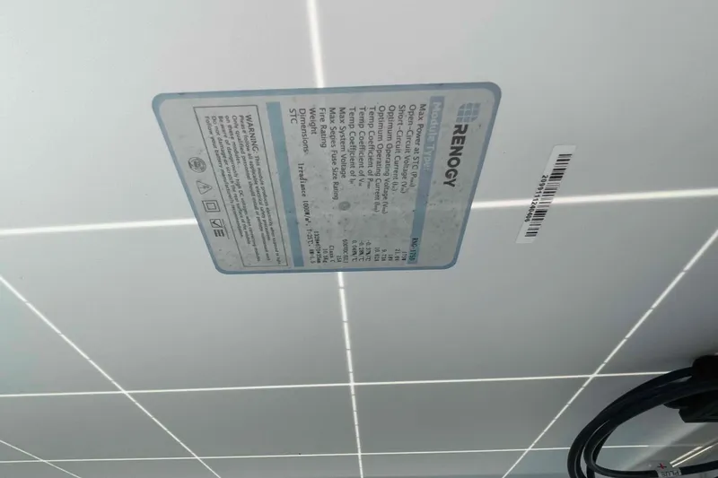 Slide: The Image of 2003 Lagoon 410-S2 catamaran deck with rigging, docked in a marina. - 65