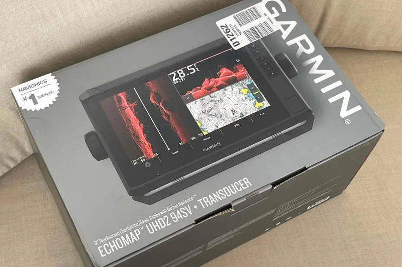 Slide: The Image of 2003 Lagoon 410-S2 catamaran cockpit with seating and table, docked in a marina. - 71