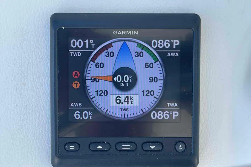 Slide: The Image of Helm of 2003 Lagoon 410-S2 catamaran with Garmin navigation system and steering wheel. - 72