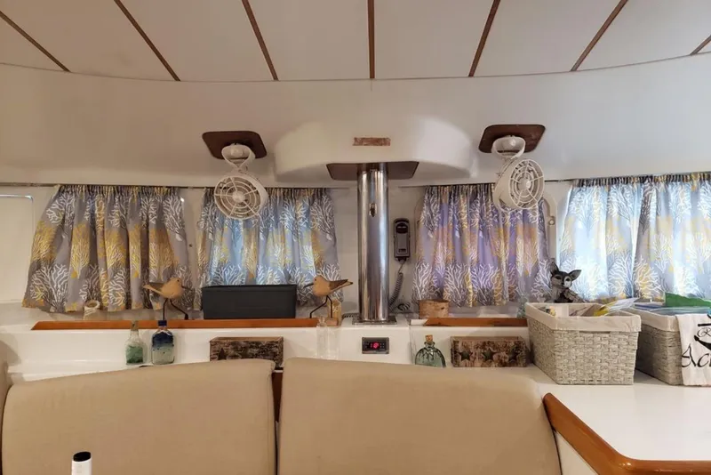 Slide: The Image of 2003 Lagoon 410-S2 catamaran docked at marina with inflatable boat attached. - 78