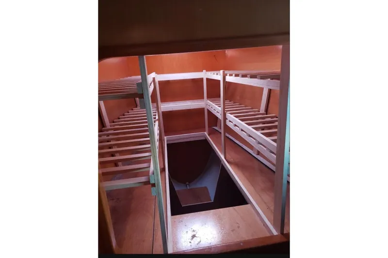 Slide: The Image of Cozy seating area on 2003 Lagoon 410-S2 catamaran with colorful cushions and ocean view. - 79