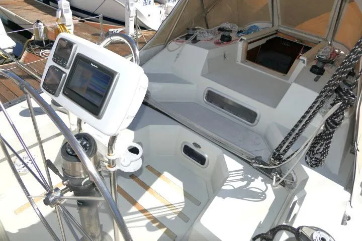 Slide: The Image of Cockpit of 1989 C&C 37/40+ sailboat with navigation equipment and steering wheel. - 41