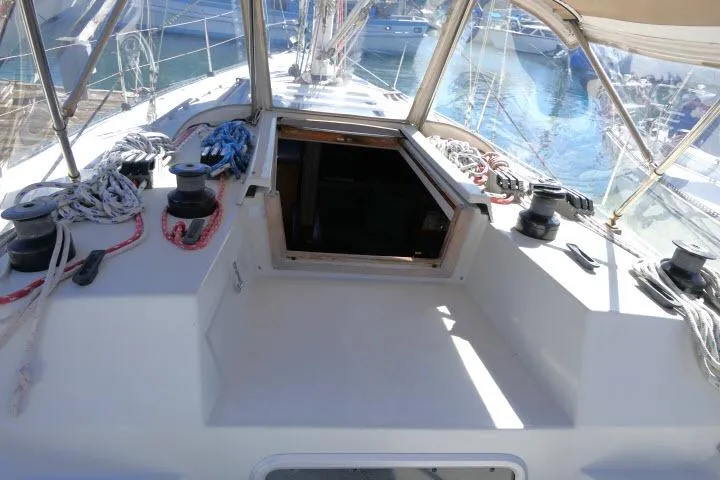 Slide: The Image of 1989 C&C 37/40+ sailboat cockpit with ropes and winches, docked in marina. - 43