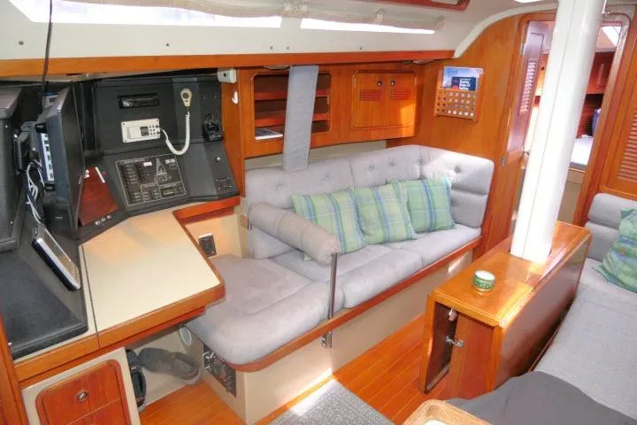 Slide: The Image of Interior of 1989 C&C 37/40+ sailboat with cozy seating and navigation equipment. - 5