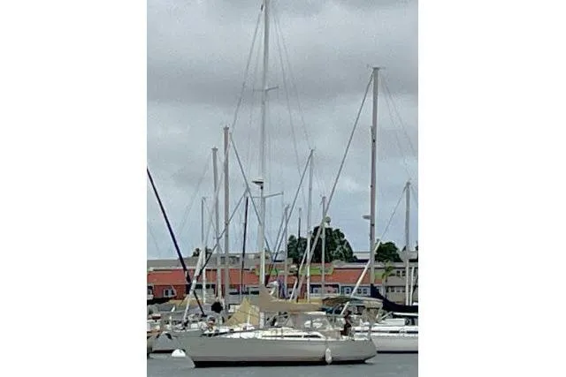 Slide: The Image of 1989 C&C 37/40+ sailboat docked in a marina with overcast skies. - 66
