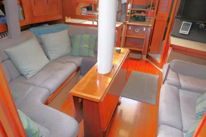 Slide: The Image of Interior of 1989 C&C 37/40+ sailboat with cozy seating and wooden finishes. - 11