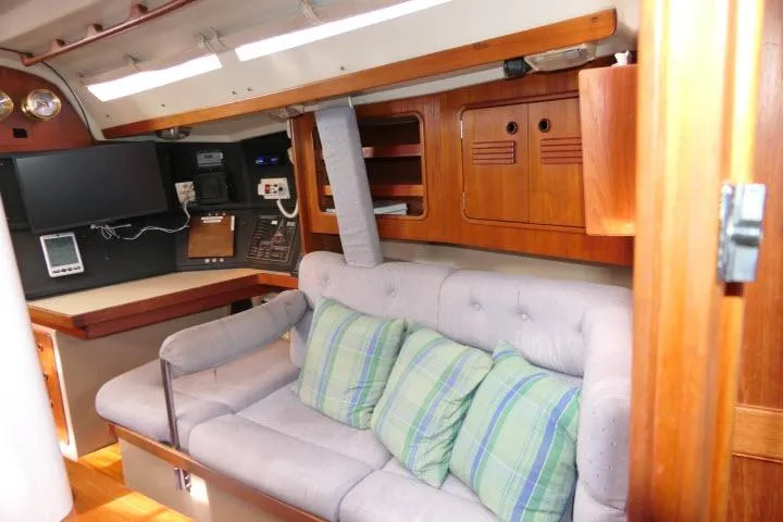 Slide: The Image of Interior of 1989 C&C 37/40+ sailboat with cozy seating and navigation equipment. - 12