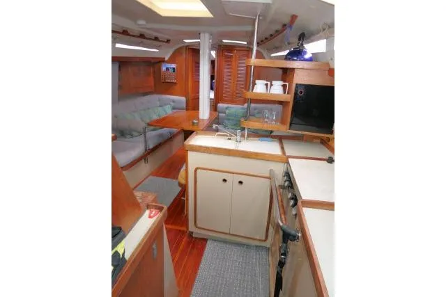 Slide: The Image of Interior of 1989 C&C 37/40+ sailboat with kitchen and seating area. - 17
