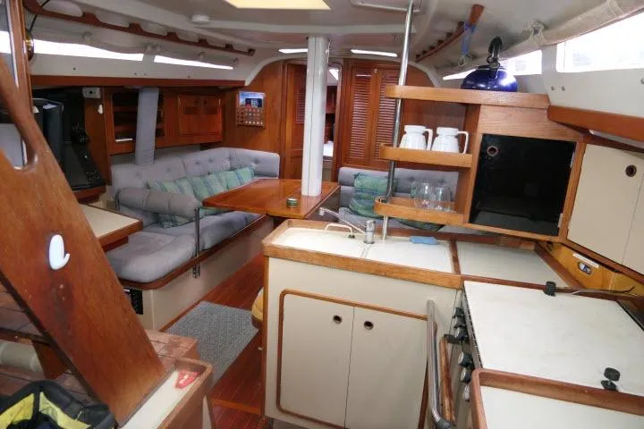 Slide: The Image of Interior of a 1989 C&C 37/40+ sailboat with cozy seating and kitchen area. - 18